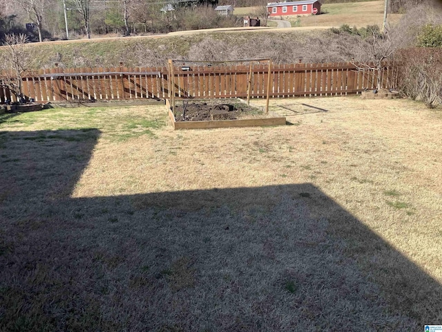 view of yard featuring a garden and fence