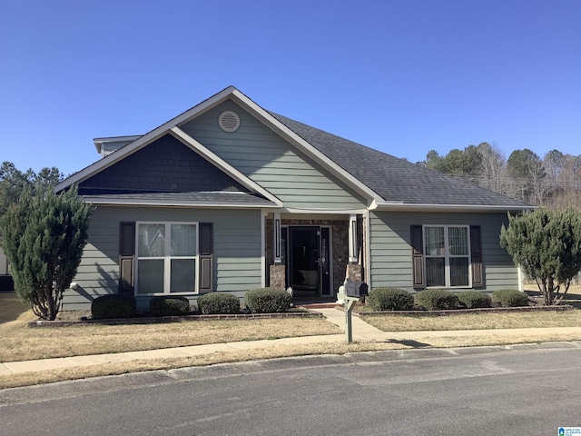 view of front of home with roof with shingles