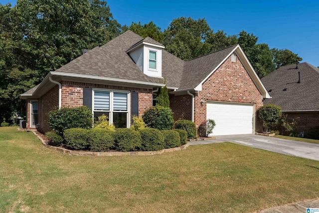 view of front of house featuring a garage, brick siding, roof with shingles, and a front yard