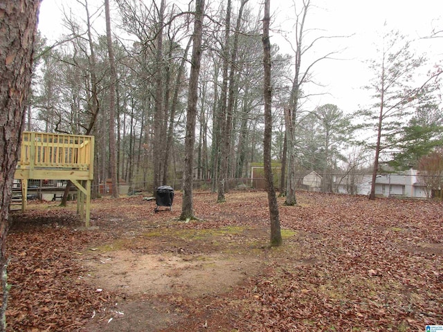 view of yard featuring a deck and stairway