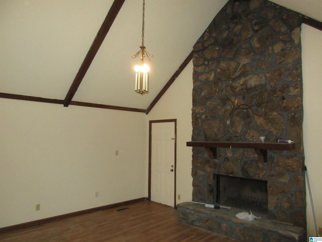 unfurnished living room with high vaulted ceiling, a fireplace, baseboards, and wood finished floors