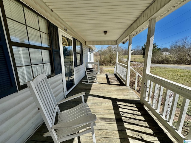 wooden terrace featuring a porch