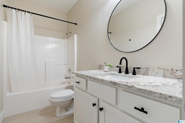 bathroom featuring shower / tub combo with curtain, vanity, and toilet