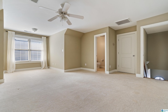 unfurnished bedroom with light colored carpet, visible vents, and baseboards