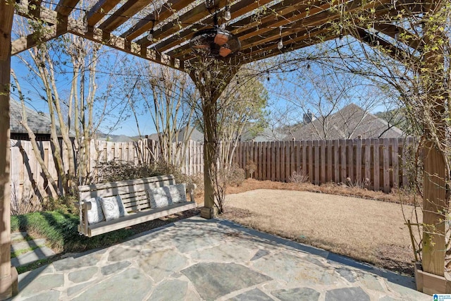 view of patio / terrace with a fenced backyard and a pergola