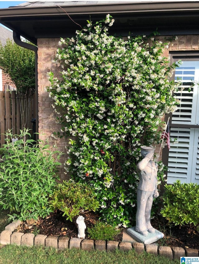 view of side of home with fence