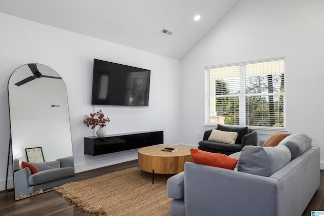 living room with baseboards, visible vents, wood finished floors, high vaulted ceiling, and recessed lighting