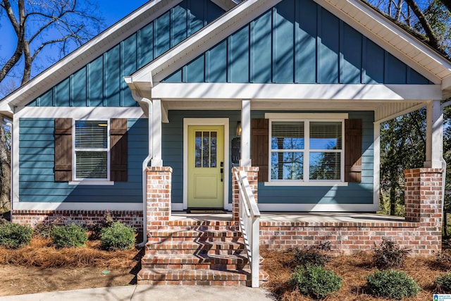 view of front facade with board and batten siding and a porch