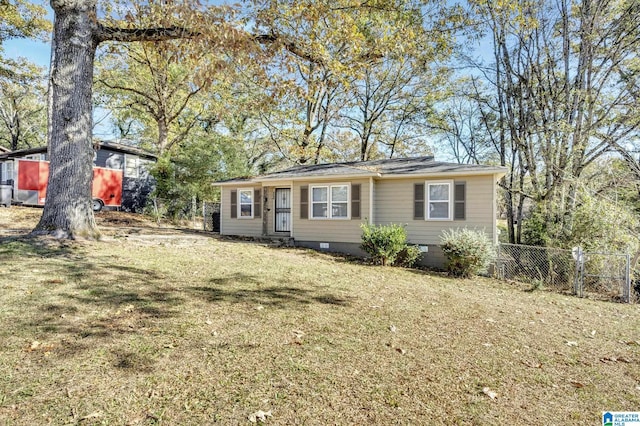 ranch-style house featuring crawl space, a front yard, and fence