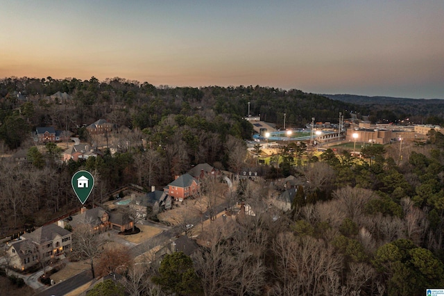 drone / aerial view featuring a forest view