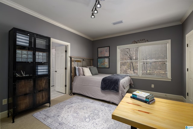 bedroom with ornamental molding, visible vents, carpet floors, and baseboards