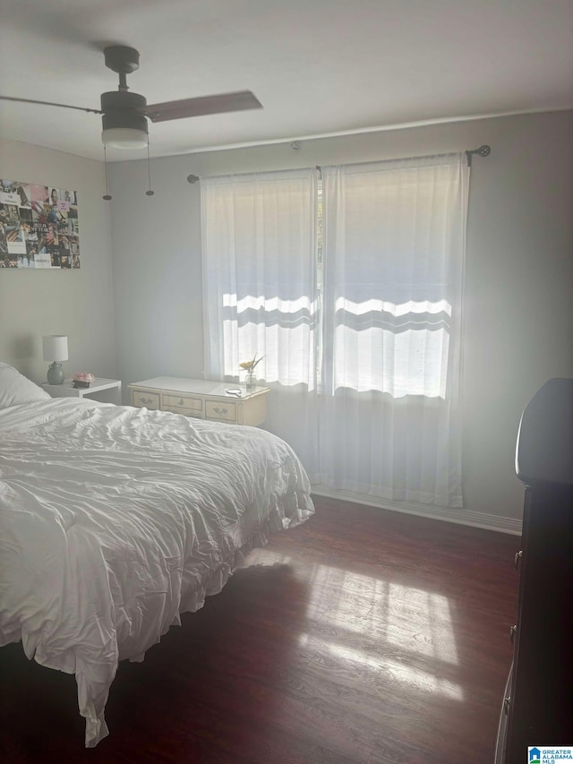 bedroom featuring a ceiling fan and wood finished floors