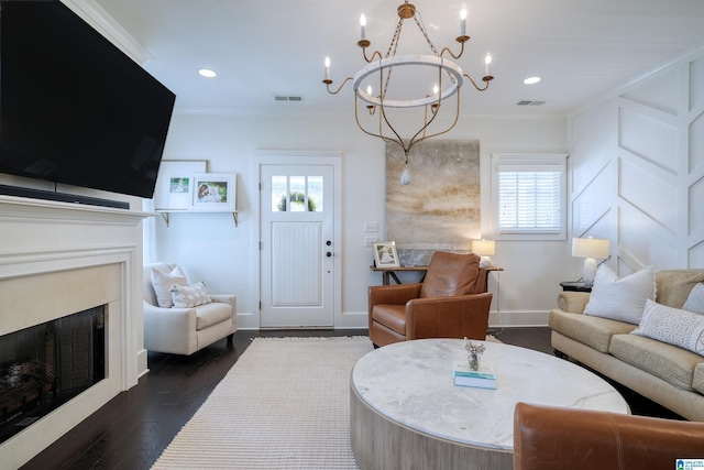 living room with visible vents, crown molding, and a fireplace