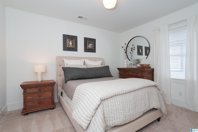 bedroom featuring carpet flooring, visible vents, and baseboards