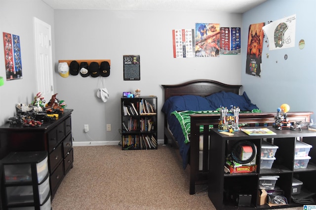 carpeted bedroom with baseboards