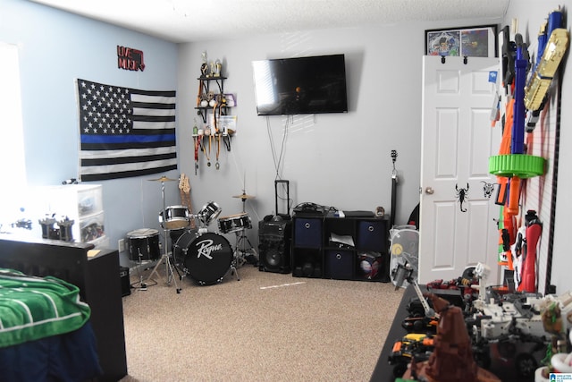 bedroom with carpet and a textured ceiling