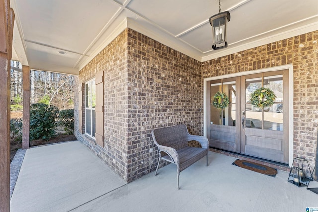 entrance to property with french doors and brick siding