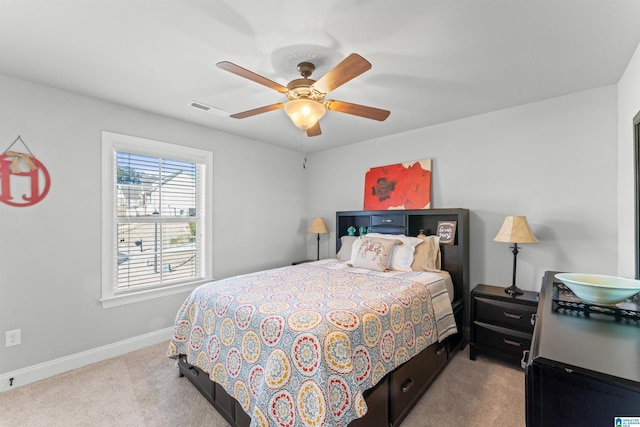 bedroom featuring ceiling fan, carpet floors, visible vents, and baseboards