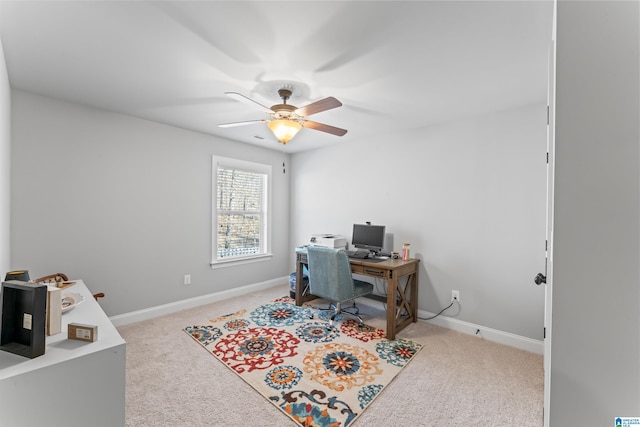 office space featuring ceiling fan, carpet flooring, and baseboards