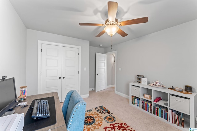 office area featuring a ceiling fan, carpet flooring, and baseboards