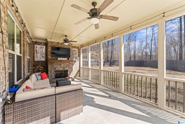 sunroom with a ceiling fan