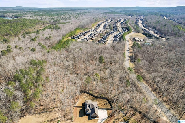 birds eye view of property with a view of trees