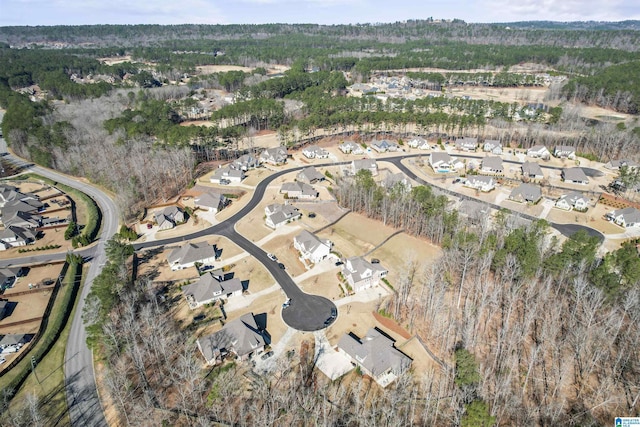 birds eye view of property featuring a view of trees