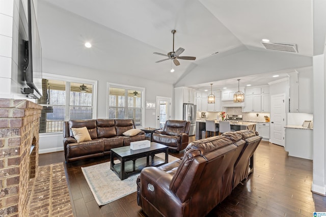 living area featuring baseboards, visible vents, a ceiling fan, dark wood-style flooring, and recessed lighting