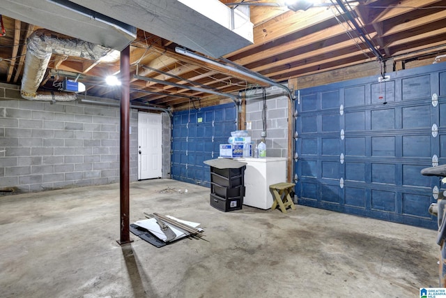 basement with a garage and washer / clothes dryer