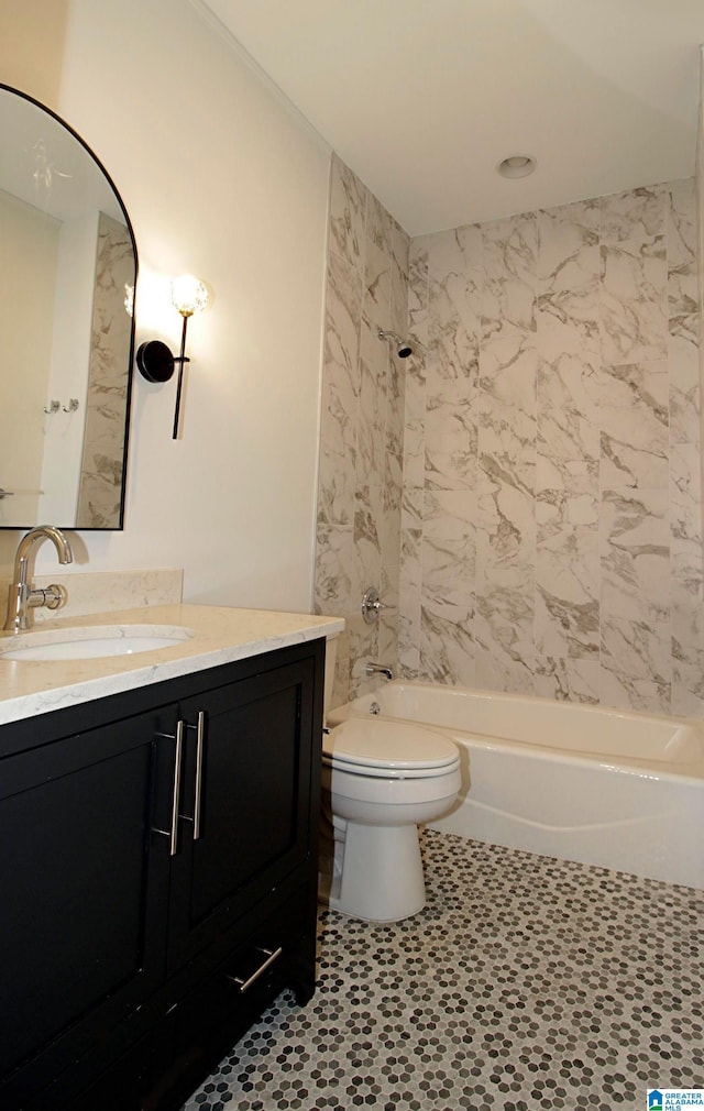 bathroom featuring toilet, shower / bathing tub combination, and vanity