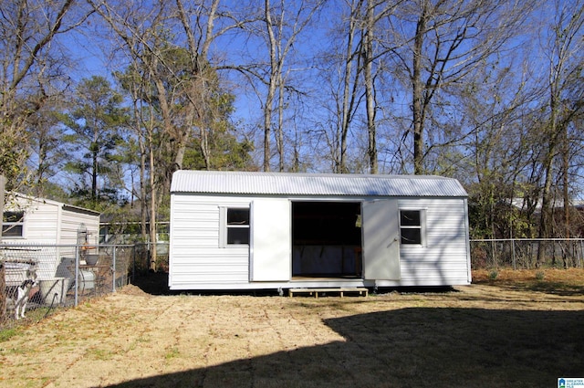 view of shed with fence