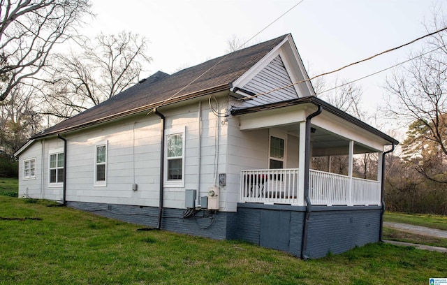 view of property exterior featuring a yard and crawl space