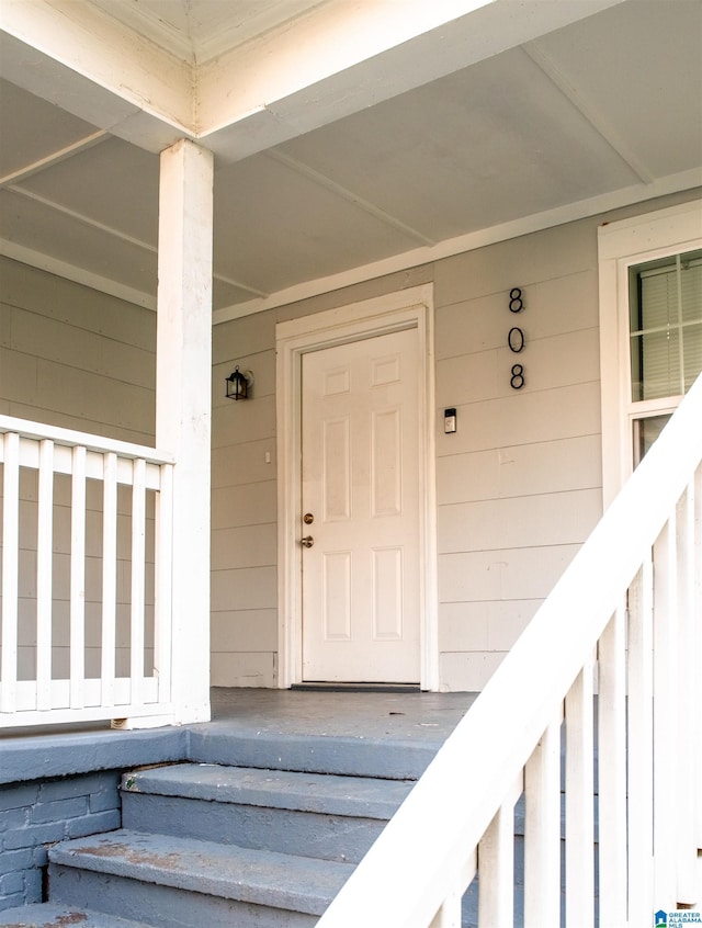 doorway to property featuring a porch