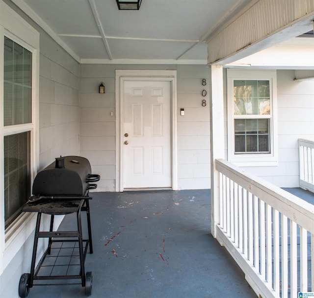 doorway to property with concrete block siding