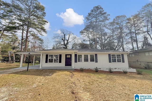 view of front of house featuring an attached carport, crawl space, driveway, and a front lawn