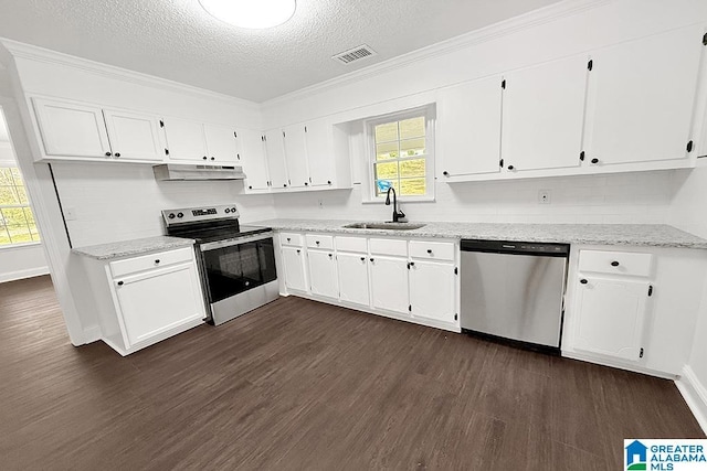 kitchen featuring white cabinets, dark wood finished floors, stainless steel appliances, under cabinet range hood, and a sink