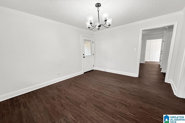 empty room with dark wood finished floors, crown molding, a textured ceiling, and an inviting chandelier