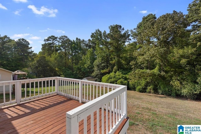 wooden deck with a yard