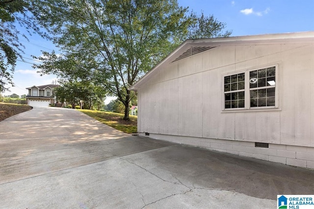 view of side of home with crawl space