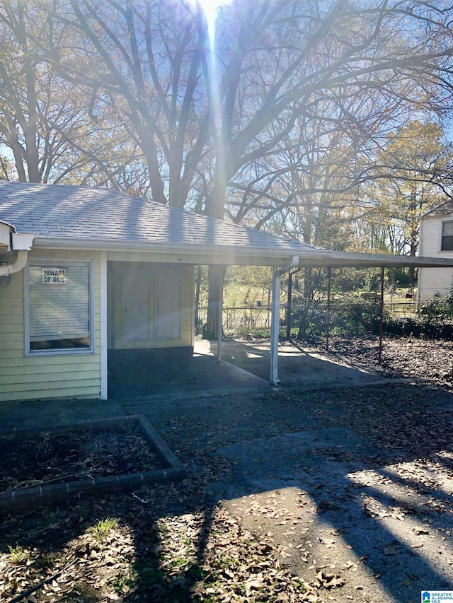 exterior space featuring a carport