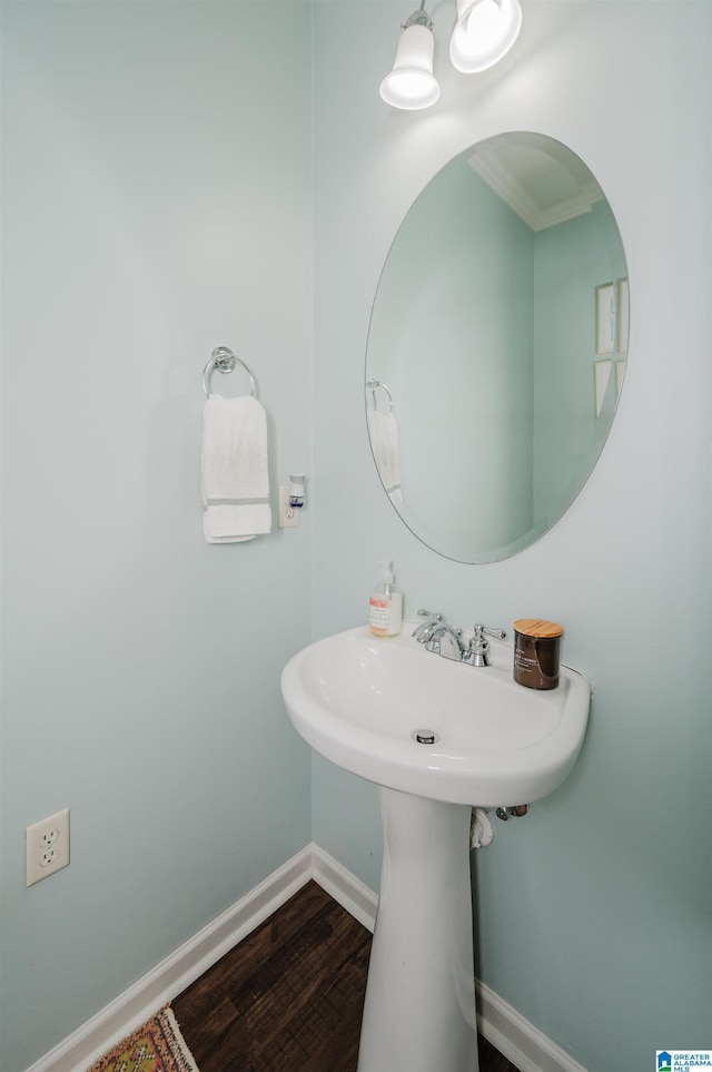 bathroom featuring wood finished floors and baseboards