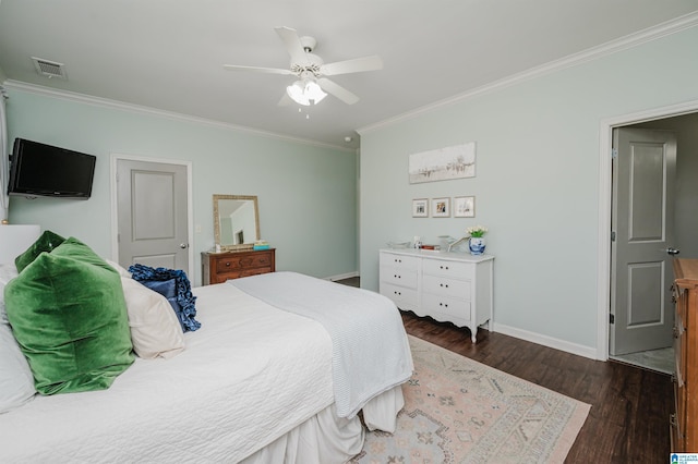 bedroom featuring baseboards, visible vents, ceiling fan, wood finished floors, and crown molding