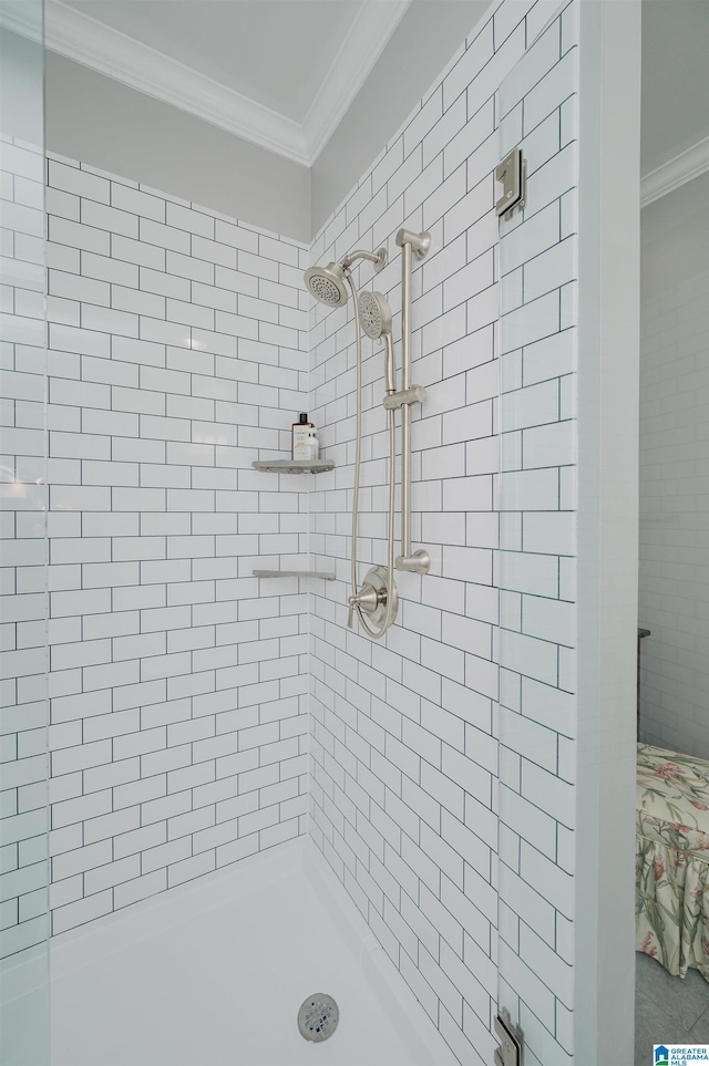 full bathroom with a shower stall and ornamental molding