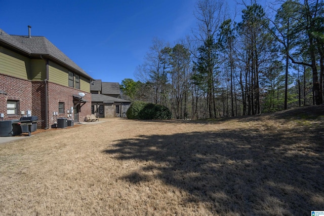 view of yard with central AC