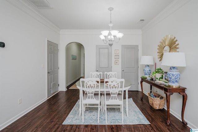 dining area with dark wood-style floors, arched walkways, visible vents, and an inviting chandelier