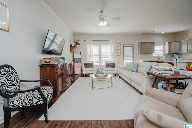 living room featuring ceiling fan, recessed lighting, wood finished floors, and crown molding