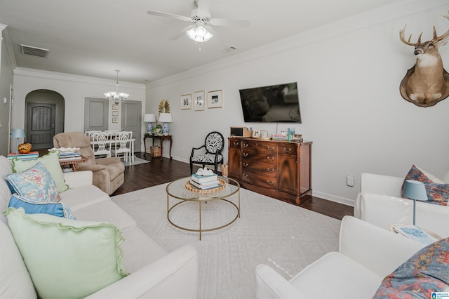 living room featuring ornamental molding, visible vents, and wood finished floors