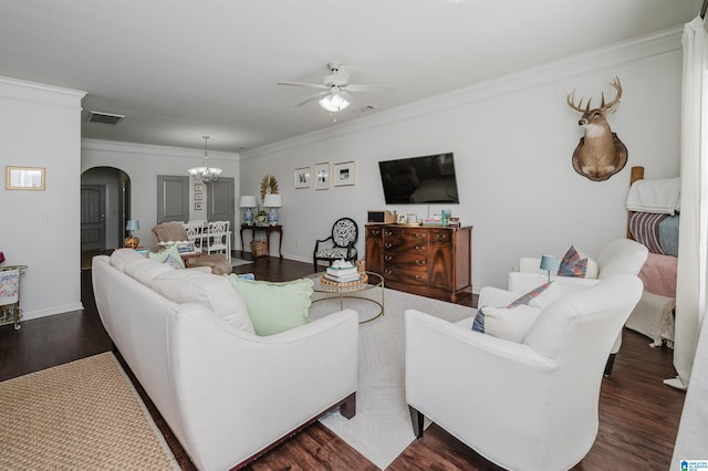 living room featuring arched walkways, crown molding, visible vents, dark wood-type flooring, and ceiling fan with notable chandelier