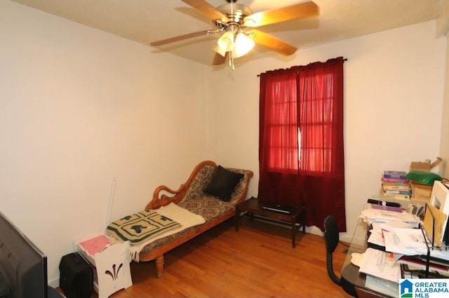 bedroom with ceiling fan and wood finished floors