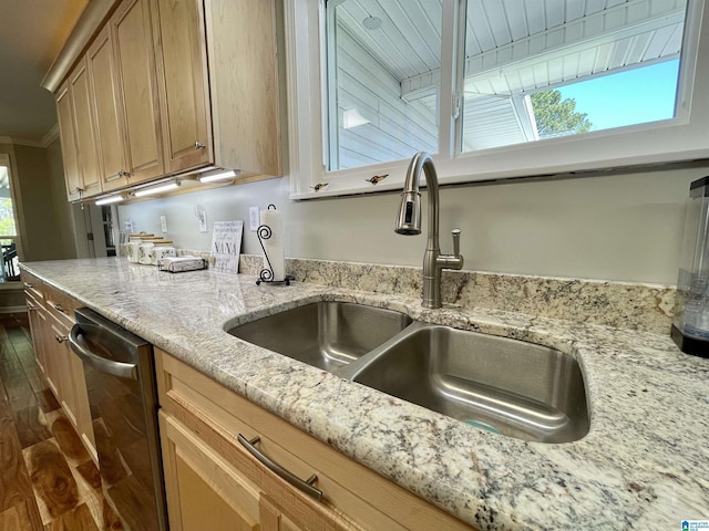 kitchen featuring dark wood-style floors, light stone counters, ornamental molding, a sink, and stainless steel dishwasher